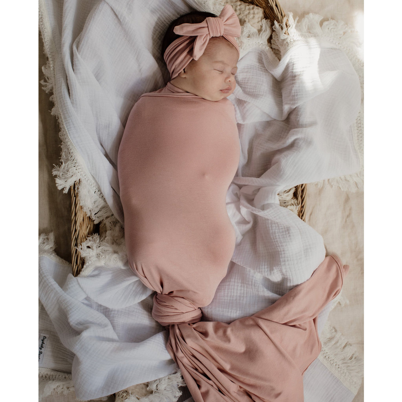 cute baby sleeping tied in Bowy Made piggy swaddle